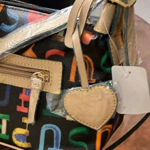 Handbag with JESUS written in bright colors.